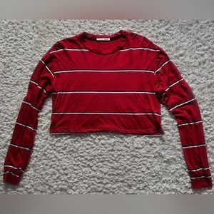 Cropped red long sleeve t-shirt with black + white stripes